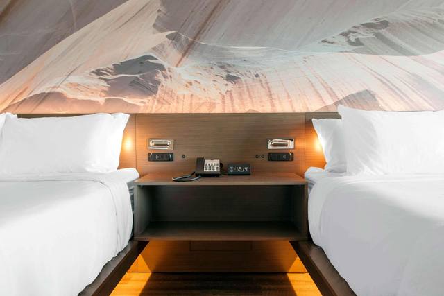 Premium bedding, desk, laptop workspace