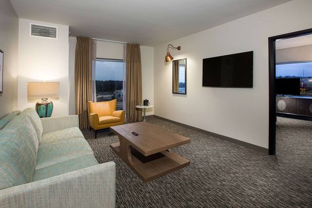 Premium bedding, desk, laptop workspace