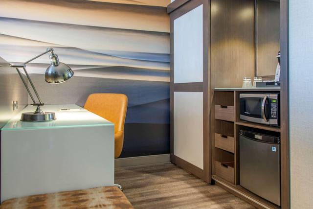 Premium bedding, desk, laptop workspace